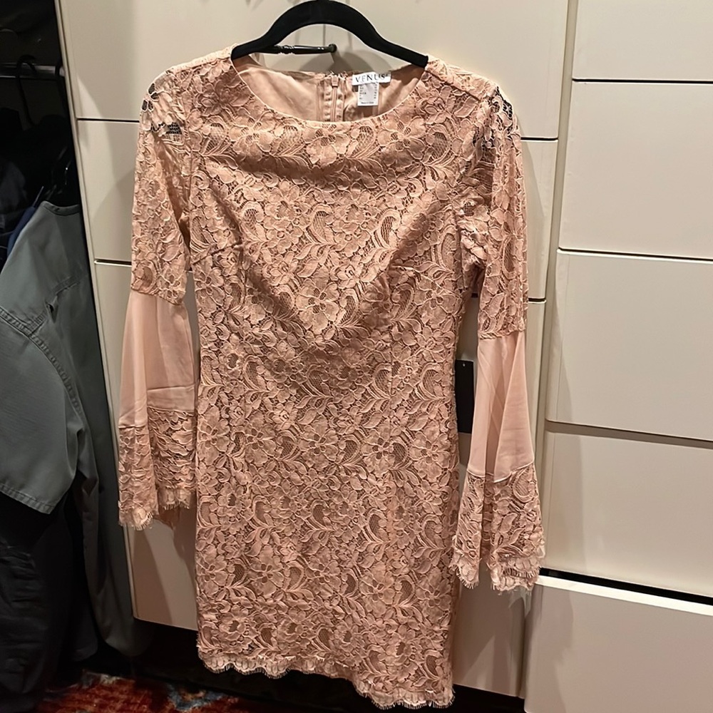 Cocktail dress. Brand new with tags. Mid length sleeves.